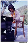 28. George playing piano